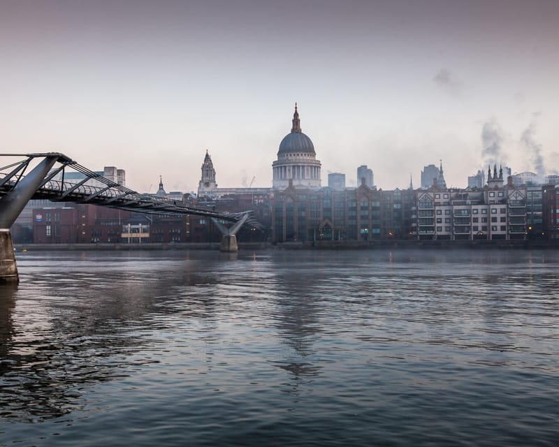 Millennium Bridge over the Thames at dawn, the dome of St Paul's on the skyline