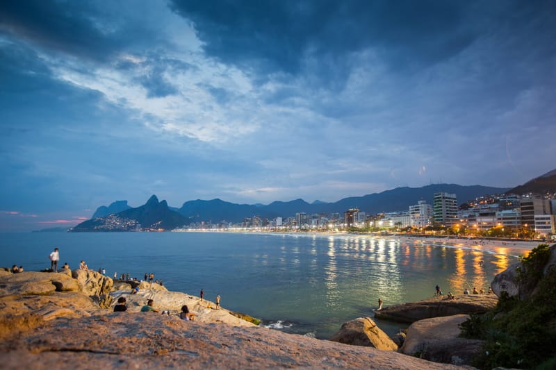 Ipanema's beachfront lights coming on at dusk, seen from Arpoador rock, Rio de Janeiro